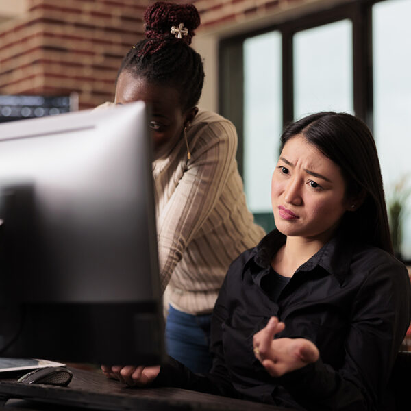 Thoughtful engineers brainstorming ideas to write code